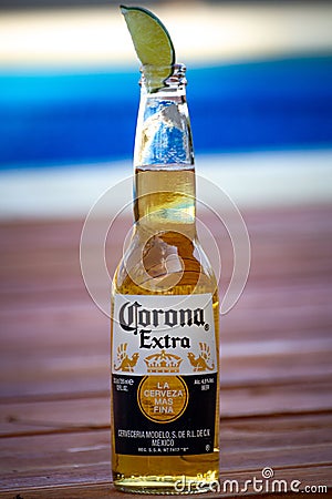 Corona Extra with pool on background Editorial Stock Photo